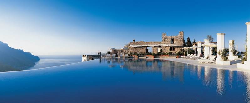 The spectacular heated infinity swimming pool and Pool Bar