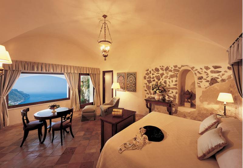 Bedroom area of an Exclusive Suite with private terrace and breathtaking sea view