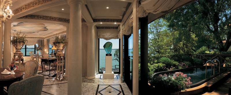 The exclusive sitting room of the Palladio Suite with its private pool shaded by jasmine shrubs
