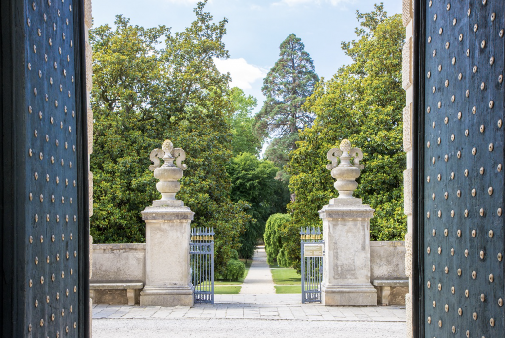 Enter through the eighteenth-century majestic gates